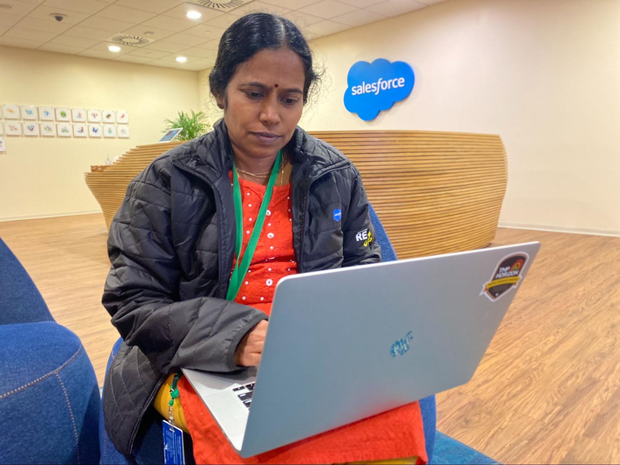 Suma Sushilendra on a laptop